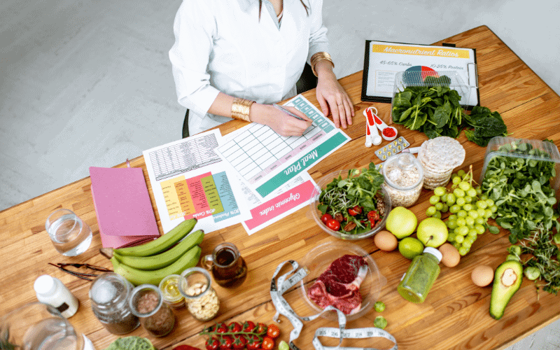 An ice skater follows a nutrition plan, consuming balanced meals and staying hydrated with water during training and competition